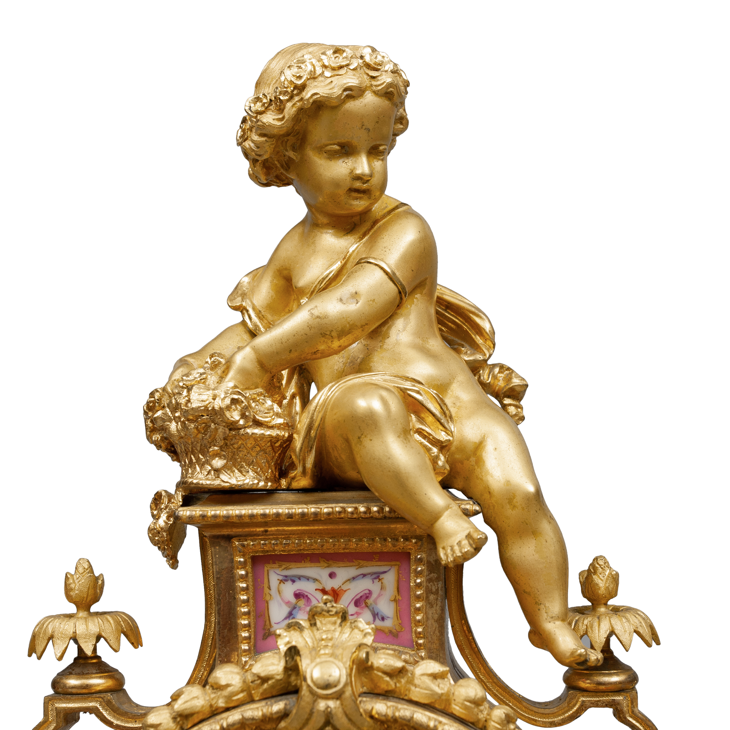 Часы с фигурой амура и два канделябра с фарфоровыми живописными вставками